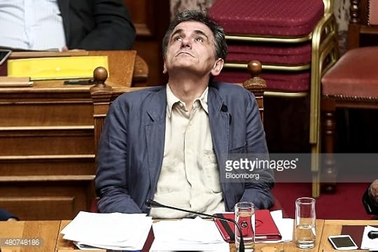 Euclid Tsakalatos, Greece's finance minister, center, pauses as he attends a parliamentary session with Yannis Dragasakis, Greece's deputy prime minister, right, and Panos Skourletis, Greece's labor minister, left, in Athens, Greece, on Wednesday, July 15, 2015. Parliament will vote Wednesday night on the measures Greece's creditors demanded as a condition for aid as capital controls ravage an economy that has already shrunk by a quarter since 2009. Photographer: Yorgos Karahalis/Bloomberg *** Local Caption *** Euclid Tsakalatos; Yannis Dragasakis; Panos Skourletis