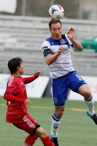 Albert Watson heads the ball in action against Ottawa. PHOTO: FC EDMONTON/TONY LEWIS