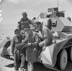 The crew of a British Cruiser Mk IV tank studying a map in the Western Desert, Egypt, 30 Apr 1941 (Imperial War Museum)