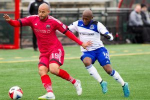 FC Edmonton's Sainey Nyassi, shown battling for the ball against Ottawa's Kyle Porter, is out for Wednesday's game against Jacksonville. PHOTO: TONY LEWIS/FC EDMONTON