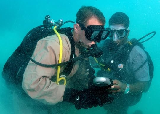 080710-N-8968M-124 ST JOHN'S, Antigua (July 10, 2008) Construction Mechanic 2nd Class Aaron Heldreth checks bottle pressures with his buddy diver, Constable Gaveline Brouet, a Region Security Service diver from St. Lucia, during Navy Diver-Global Fleet Station 2008. The mission of Global Fleet Station is to maintain strong multi-lateral partnerships support the U.S. maritime strategic goals of enhancing regional stability and security by promoting multinational working relationships. U.S. Navy photo by Mass Communication Specialist 2nd Class Kori L. Melvin (Released)