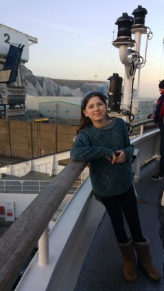 Laura on ferry in front of White Cliffs of Dover