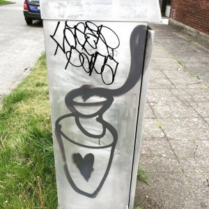 photo of graffiti of a coffee cup