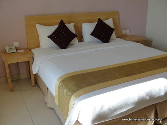 guest room bed at the Laprima Hotel on Flores Island, Indonesia