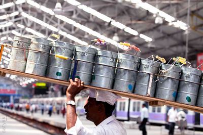 Dabbawala in action at a station in Mumbai