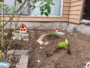 Think about the space you have available and what you might want to fit there. This was one of the earliest stages of my garden: I built some tiny hills and rockeries and planned where some of the houses might go.