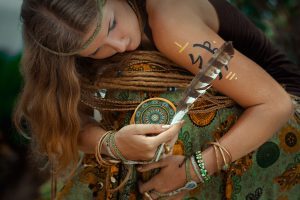 close up of young woman with tarot cards