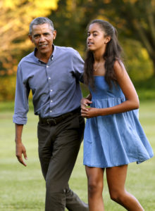 Malia and her father/photo Yuri Gripas Reuters