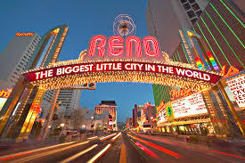 Photo of the Reno street arch lit up saying Reno, the Biggest Little City in the World.