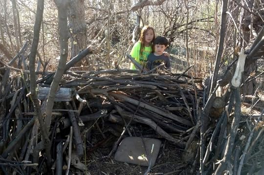SteelyKid and the Pip behind a wall of sticks.