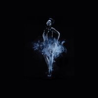 Woman in dress with prosthetic leg that emits smoke.