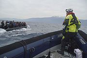 Refugees_crossing_the_Mediterranean_sea_on_a_boat,_heading_from_Turkish_coast_to_the_northeastern_Greek_island_of_Lesbos,_29_January_2016