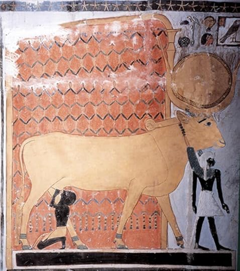 Hathor as a cow suckling a pharaoh.