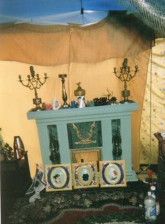 Our fireplace, and some ceramic portraits. 