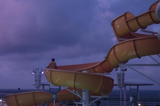 Maintenance workers cleaning and checking one of the waterslides on board.