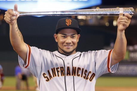 National League All-Star Cabrera of the San Francisco Giants holds the MVP trophy at the Major League Baseball's All-Star Game in Kansas City