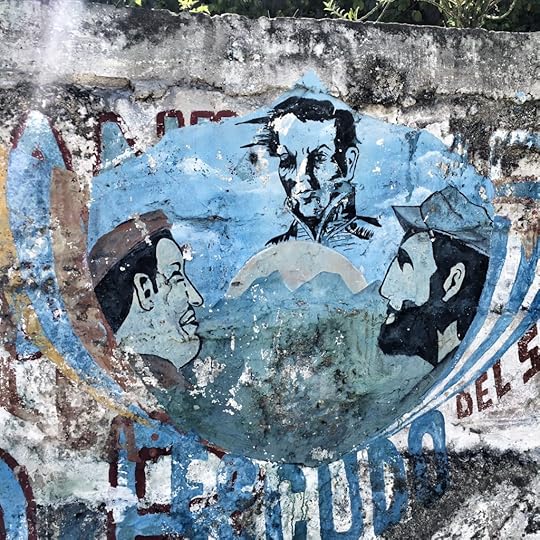 Che Guevara and Hugo Chavez looking up at Simon Bolivar