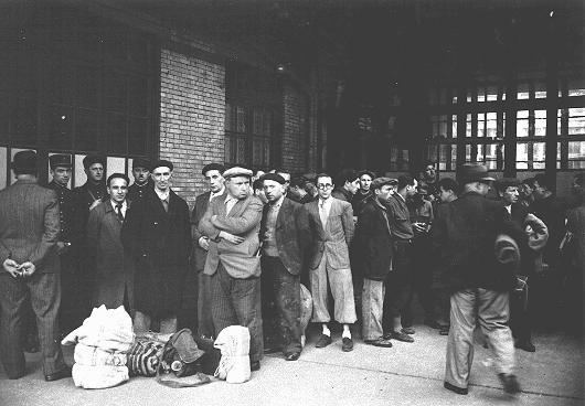 After the first roundup in Paris, French police escort foreign Jewish men from the Japy school to deportation trains at the Austerlitz station. Paris, France, May 14, 1941. (Bibliotheque Historique de la Ville de Paris via US Holocaust Museum)