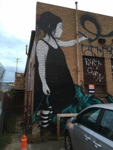 Painting of girl on the side of a Brunswick factory