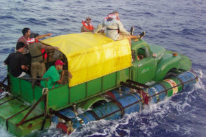 STRAITS OF FLORIDA (July 17, 2005)--Eleven Cuban migrants attempt to reach the United States on a Chevy flatbed truck rigged with pontoons, in the Straits of Florida. USCG photo by Fireman Greg Ewald.