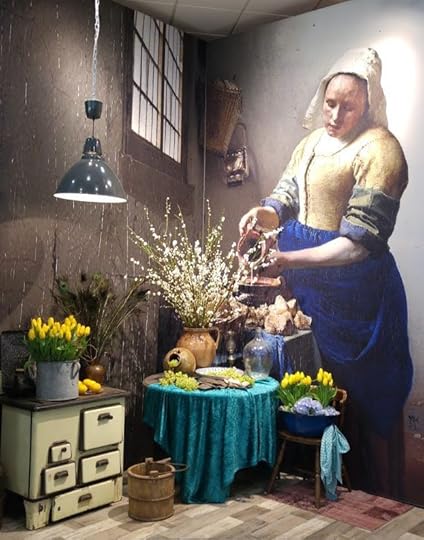 Giant Dutch Master painting reproduction with flower arrangements in front