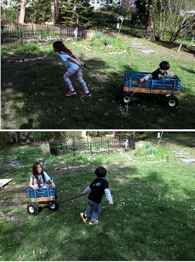 SteelyKid and The Pip taking turns pulling each other in their wagon.
