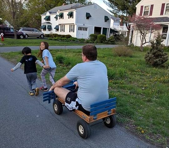 SteelyKid and The Pip pulling me on a wagon.