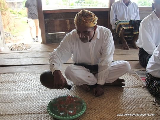 serving arak liquor at Melo Village on Flores Island in Indonesia