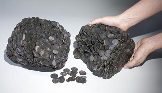 Lumps of coins that were discovered at sea, weighing a total of c. 20 kilograms.