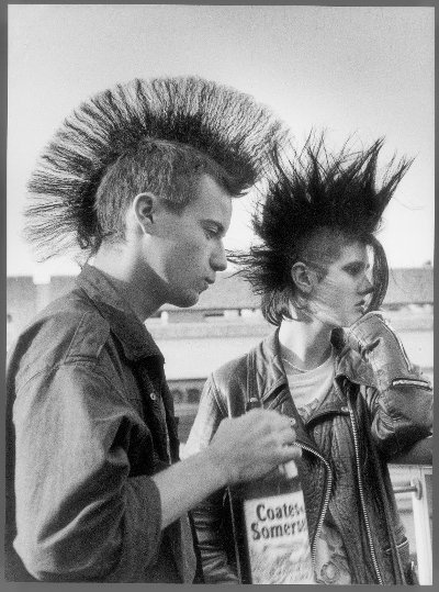 Shirley Baker, Two punks drinking cider, Stockport, 1983 © Shirley Baker Estate, Courtesy of Shirley Baker Estate/ Mary Evans Picture Library