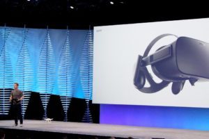 Facebook chief Mark Zuckerberg uses a small drone and an Oculus Rift virtual reality headset during a keynote presentation at the social network’s annual developers gathering in San Francisco on April 12, 2016 / GLENN CHAPMAN/AFP/Getty Images