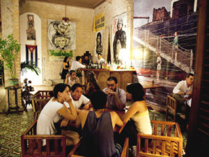 Patrons at Madrigal, the loft-style bar and home of the filmmaker Rafael Rosales, in Havana, Feb. 25, 2012. Paladares, a new group of privately owned restaurants, are bringing a dash of style and enticing food to Havana's dining scene. (Jose Goitia/The New York Times) - PHOTO MOVED IN ADVANCE AND NOT FOR USE - ONLINE OR IN PRINT - BEFORE MARCH 18, 2012. -
