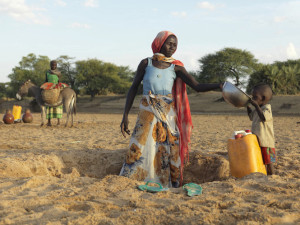 Jumana from Hillé Bar village near Dabkere, Chad, collects water from the dry ground. Climate change is hitting Chad hard with erratic and exceptionally high temperatures and a lack of rainfall. Her millet which she grows to survive has dried out and has stunted growth. The crop is ruined and Jumana and her family are facing extreme hunger. Tearfund visited Chad to tell the story of families who have been affected by the current food-security crisis in Niger – and helped find a way through it.