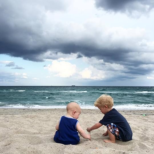 Brothers playing on the beach