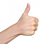 Hand with thumb up isolated on white background. Ok sign by woman