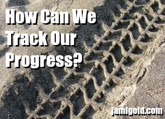 Tire tracks in sand with text: How Can We Track Our Progress?