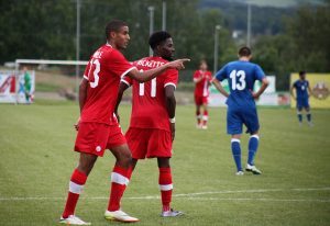 Tesho Akindele and Tosaint Ricketts celebrate a goal against Azerbaijan. PHOTO: CANADA SOCCER