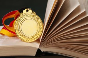 Gold medal on the book