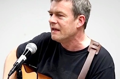 Andy Worthington singing his 'Song for Shaker Aamer' at an event in Washington, D.C. on January 10, 2016, the day before the 14th anniversary of the opening of Guantanamo (Photo: Justin Norman).