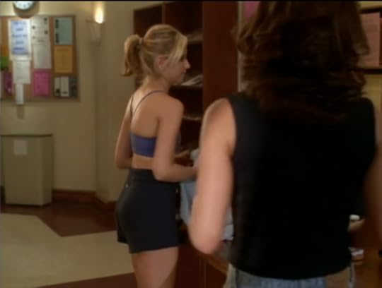 Buffy is wearing a blue sports bra and very short black exercise shorts
