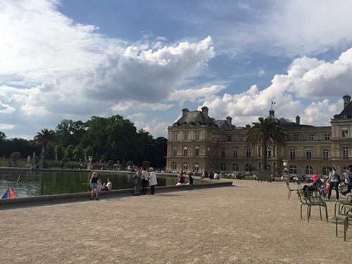 In Paris, people hang out at the Luxembourg Gardens like it's the beach, picnicking, adoring the palace and people watching. One of the rare sunny days here with stunning clouds.
