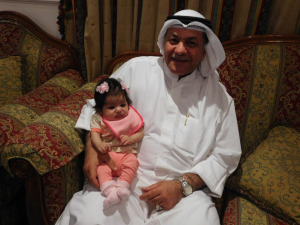 My special friend SOUD happy with one of his 12 grandchildren!