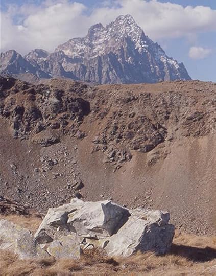 Block of raw jadeitite from the Oncino valley with Mont Viso in the background.