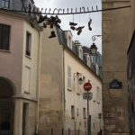 The bar where the shoes are strung was once the gate to a plague graveyard. est-ce vrai? #Paris #writerslife #french #5tharrondissement #travel