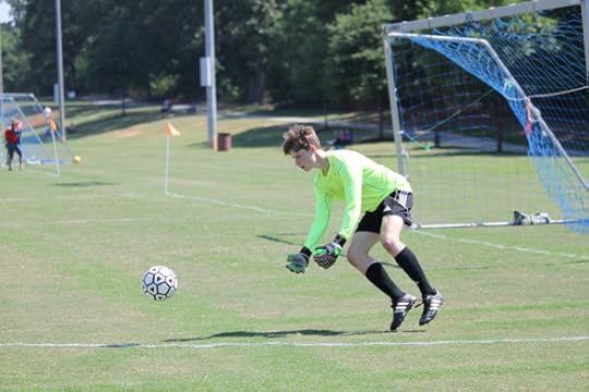 My favorite keeper collecting a bouncing ball as it comes into his box.