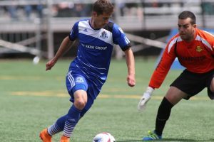 FC Edmonton's Jake Keegan, just before he puts the ball through Fort Lauderdale keeper Diego Restrepo's legs. PHOTO: FC EDMONTON/UWE WELZ