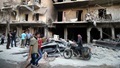 Men inspect damage after an air strike on Aleppo's rebel-held al-Shaar neighbourhood, Syria June 8, 2016. REUTERS/Abdalrhman Ismail