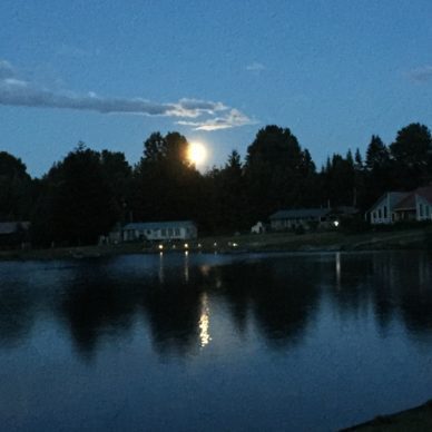 full moon over the lake on summer solstice