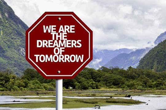 We Are The Dreamers Of Tomorrow written on red road sign