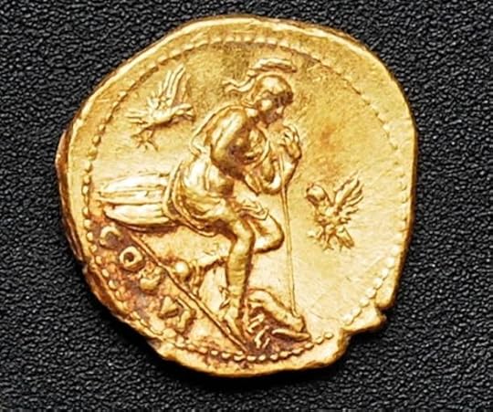 One of the gold coins discovered among the bodies.